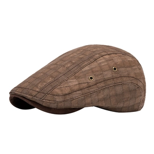 British style plaid flat cap in brown check pattern with side metal eyelet details