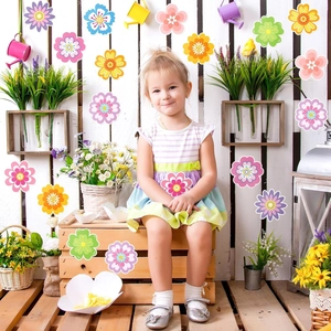 Close-up of colorful spring flower cutouts decorating a wooden chest in a child's room