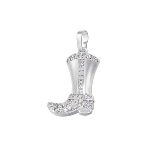 Macro view of silver cowboy boot pendant with sparkling cubic zirconia inlay