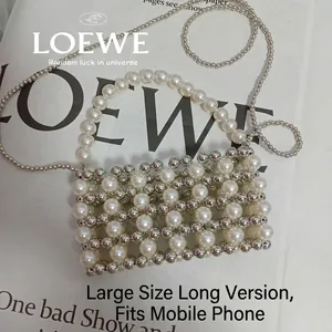Detailed grid weave of white pearls and silver metal beads for a mini crossbody bag
