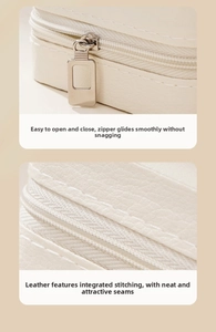 Detail of white PU leather jewelry box with smooth silver zipper and lychee texture