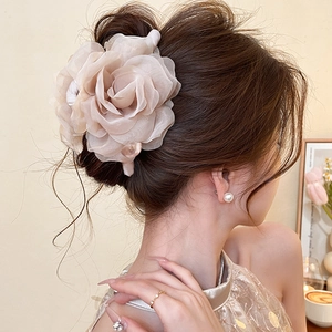 Elegant rose mesh hair claw clip with pearls for high-end bun styles in champagne pink