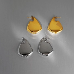 Close-up of polished 18K gold plated fan-shaped earrings with liquid metal textures