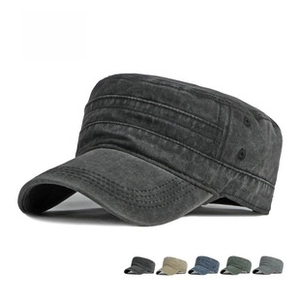 Detail of grey flat top army cap showing top stitching and side metal eyelets