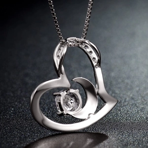 S925 sterling silver heart necklace with moon pendant and central round clear gemstone