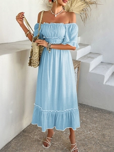 Detail of light blue off-shoulder maxi dress with ruffle hem and white wave trim accents