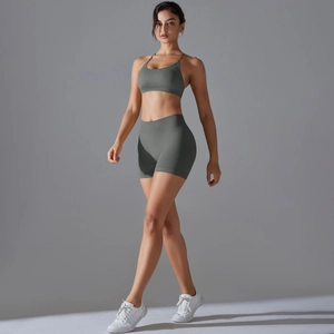Detail view of seamless dark grey knitted yoga set featuring sports bra and high waist shorts