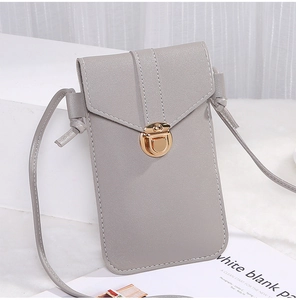 Detailed view of grey pebble leather crossbody phone bag with gold metal lock closure