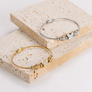 Elegant butterfly wire bracelet with crystal inlay in gold and silver finishes