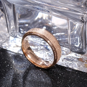 Detail of rose gold titanium ring with matte exterior and polished inner surface