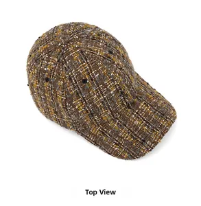 Top view of brown tweed baseball cap featuring retro textured woven fabric design