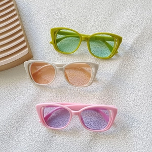 Kids vintage cat eye sunglasses in green, beige and pink with hollow frames for fashion