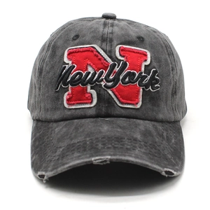 Distressed dark gray cotton baseball cap with red N and New York embroidery on white background