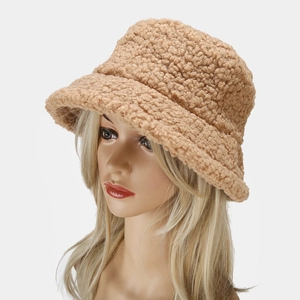 Detail of soft khaki faux shearling texture on a warm winter fisherman bucket hat