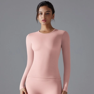 Close-up of pink long-sleeve yoga top with slim fit tailoring and smooth texture