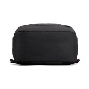 Detailed bottom view of black nylon travel backpack showing durable seams and flat base