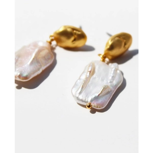 Vintage French baroque pearl stud earrings with textured gold plating on white background