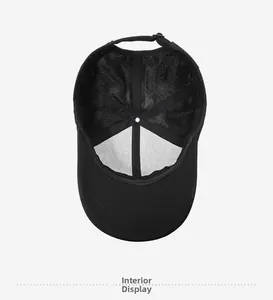 Detailed interior of a black baseball cap with breathable mesh and adjustable strap buckle