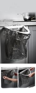 Detail of wall-mounted gray kitchen bin showing compression ring and bag installation
