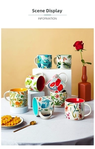 Detailed view of Nordic ceramic mugs with vibrant floral patterns and colorful inner glaze