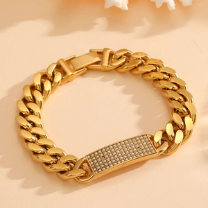 Golden Cuban chain bracelet featuring a sparkling crystal-encrusted rectangular plate