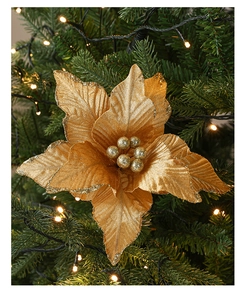 Detailed view of 26cm gold glitter Christmas flower on decorated pine tree branch