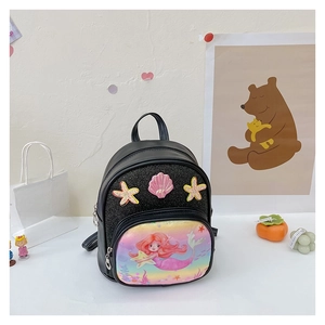 Detail of mermaid backpack featuring glitter fabric, sequin shell, and starfish accents