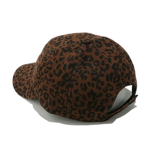Detail view of leopard print baseball cap featuring adjustable hook and loop back strap
