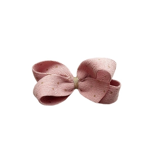Pink velvet bow hair clip with gold glitter accents and layered retro fabric design