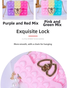 Detail of heart-shaped silicone pop purse with gold metal clasp and pearl charm