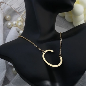 Elegant gold-plated capital letter C pendant necklace on a minimalist link chain