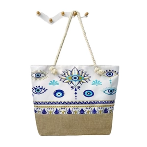 Canvas evil eye tote bag with rope handles and a beige linen patchwork bottom design