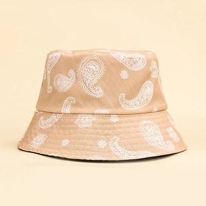 Detail shot of beige paisley bucket hat featuring intricate stitching and premium canvas texture