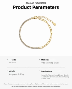 Detail view of 925 sterling silver gold bracelet with zircon tennis chain and paperclip links