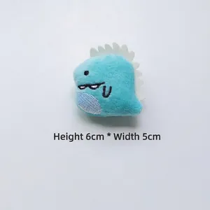 Detailed close-up of a blue plush dinosaur accessory with 6cm height and 5cm width