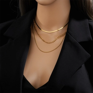 Three-layer gold titanium steel necklace featuring snake, Figaro, and twisted chain styles