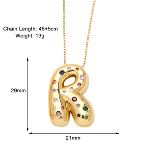 Detail view of gold letter R pendant with colorful zircons and size measurements