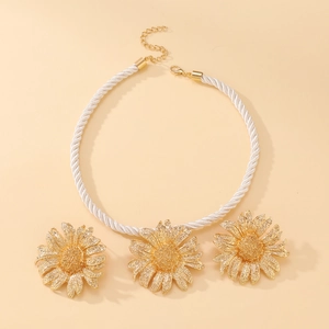 Vintage golden sunflower jewelry set with white braided cord necklace and earrings
