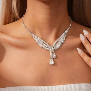 Detail of luxury teardrop diamond pendant necklace showing sparkling rhinestones and elegance