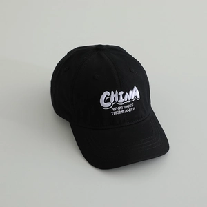 Detail of 3D white CHINA embroidery and lettering on a black cotton baseball cap