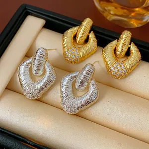 Elegant gold and silver rhombus earrings with brushed texture and micro-inlaid crystals
