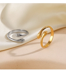 Detailed close-up of hugging hand rings in polished gold and silver finishes