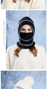 Detail of a black knitted winter balaclava with grey stripes and plush fur lining