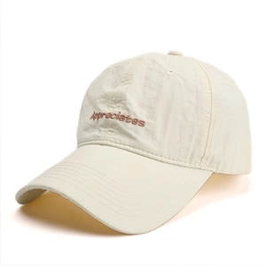 Detail of embroidered 'Appreciates' lettering on quick-dry beige baseball cap fabric