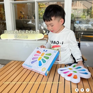 Detail of child playing with butterfly bubble fidget toy for sensory motor skills