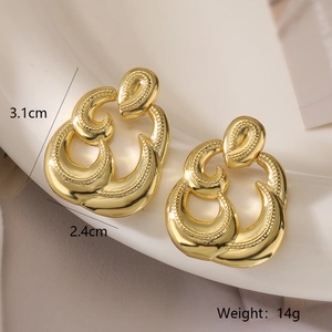 Detail view of gold geometric earrings with woven texture, size 3.1cm by 2.4cm and 14g weight