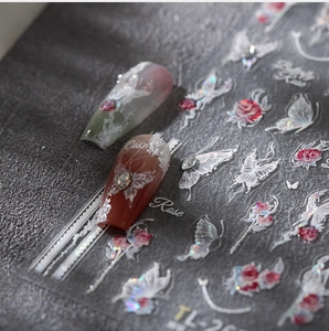 Detail view of 5D embossed nail stickers featuring red roses and white butterflies