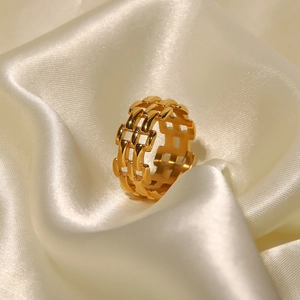 Elegant 18k gold plated mesh band stainless steel ring on ivory silk background