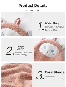 Detail view of pink coral fleece towel with thick strap, embroidery and soft texture