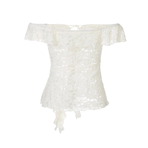 Detail of white lace off-shoulder top with intricate hollow patterns and tie-up hem